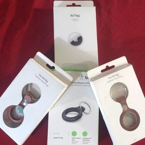 4 pack Apple AirTags, 2 leather key rings, and a Secure Holder With Key Ring